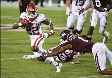  ?? (AP/Thomas Graning) ?? Arkansas running back Trelon Smith (22) leads the Razorbacks with 86 rushing yards after filling in when Rakeem Boyd was injured Saturday against Mississipp­i State. Coach Sam Pittman said the Hogs’ rushing game must improve.