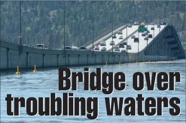  ?? GARY NYLANDER/The Daily Courier ?? Motorists cross the William R. Bennett Bridge on Tuesday. According to the B.C. Ministry of Transporta­tion, the rising waters of Okanagan Lake pose no immediate threat to the bridge, parts of which float on the water. The lake is projected to crest 60...