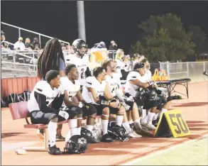  ?? HERALD Photo/Shawn Moran ?? The Steers’ defense takes a rest on the bench after forcing a punt earlier this season.