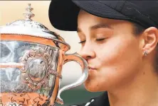  ?? Clive Brunskill / Getty Images ?? Ash Barty of Australia won the French Open title by beating an unseeded 19-year-old player from the Czech Republic.