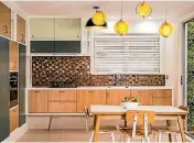  ?? BEAVER KITCHENS ?? There’s a strong mid-century look to this new kitchen by Beaver Kitchens in a 1950s bach at Lake Rotoma.