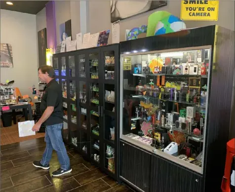  ?? Amanda Parrish/Post-Gazette ?? Gary McBurney, co-owner of Vapor Galleria, said Facebook is an important platform for the shop to push out its new products.