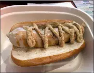  ?? Arkansas Democrat-Gazette/ERIC E. HARRISON ?? You can substitute a bratwurst (with optional spicy mustard) for the Basic Hot Dog at Lucky Lou’s.