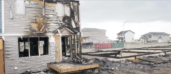  ?? KEVIN HILL ?? A townhouse complex in Martensvil­le was destroyed and two other buildings damaged in the latest fire to hit homes still under constructi­on. The local fire department says the cause of the blaze can’t be determined because of the amount of damage but...
