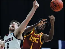  ?? TIM NWACHUKWU/ GETTY IMAGES ?? Drew Timme (2) of the Gonzaga Bulldogs competes for the ball with Chevez Goodwin (1) of the USC Trojans on Tuesday in Indianapol­is, Ind.