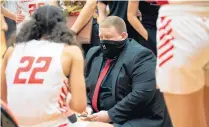  ?? KYLE TELECHAN / POST-TRIBUNE ?? Chris Seibert, the 2020-21 Post-Tribune Girls Basketball Coach of the Year, talks to his team late in Crown Point’s win against Fort Wayne Carroll in the Class 4A LaPorte Semistate onFeb. 20.