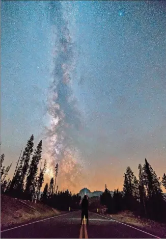  ?? TRAVIS D. AMICK COURTESY OF ?? The Milky Way above the entrance road to Redfish Lake in Central Idaho Dark Sky Reserve.