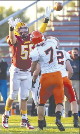  ?? Staff photo/David Pence ?? New Bremen’s Bryce Blickle attempts to bat down Coldwater’s Myles Blasingame’s pass in Friday’s Midwest Athletic Conference football game.