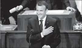  ?? PABLO MARTINEZ MONSIVAIS / AP ?? French President Emmanuel Macron puts his hand over his chest Wednesday during his address to a joint meeting of Congress on Capitol Hill in Washington.