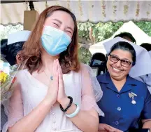  ??  ?? THE MASK CAN’T HIDE THE SMILE OF THANKS AND THE TEARS OF RELIEF; Lanka’s first coronaviru­s victim is given a clean bill of health after waiting weeks at death door at the IDH