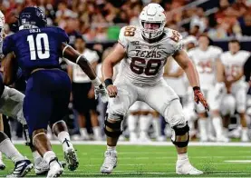  ?? Eric Gay / Associated Press ?? Texas offensive lineman Derek Kerstetter, playing against Rice in 2019, is back as a fifth-year senior after a devastatin­g injury in 2020.