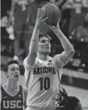  ?? RICK SCUTERI/AP ?? Arizona forward Azuolas Tubelis shoots against USC during the second half on Thursday in Tucson.