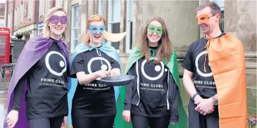  ??  ?? Members of the Macclesfie­ld branch of medical communicat­ions company Prime Global at last year’s pancake race