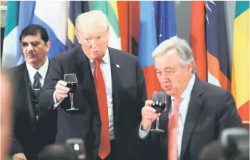  ??  ?? Trump raises his glass in a toast alongside United Nations Secretary-General Antonio Guterres during a luncheon for world leaders during the 73rd session of the United Nations General Assembly in New York, US. — Reuters photo