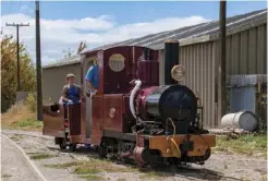  ??  ?? Back at the yard (above) and heading into the workshop (below). The volunteers’ next job is to build Donald his own shed, as vapour exuding from the steam engine after it stops running condenses and rusts tools