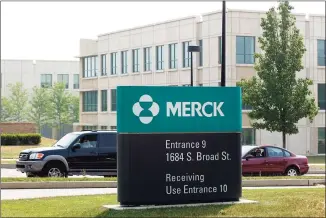  ?? Tom Mihalek / AFP via Getty Images ?? President Joe Biden said Tuesday that drugmaker Merck & Co. will help produce rival Johnson & Johnson’s newly approved shot.