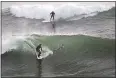  ?? DAN COYRO — SANTA CRUZ SENTINEL ?? Surfers catch waves in Steamer Lane off Santa Cruz on Thursday afternoon.