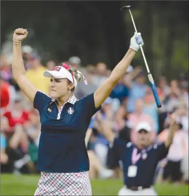  ?? The Associated Press ?? Lexi Thompson of the United States celebrates after winning the 15th hole against Europe’s Anna Nordqvist, of Sweden, during their singles match in the Solheim Cup on Sunday in West Des Moines, Iowa.