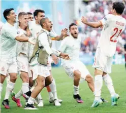  ?? Associated Press ?? ↑
Spain’s players celebrate after their victory against Croatia in a Euro match on Monday.