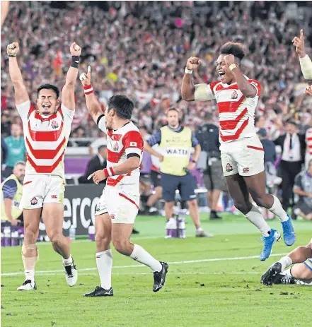  ??  ?? Japan players celebrate their win against Scotland at the 2019 Rugby World Cup.