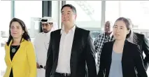  ?? OSAMA FAISAL/ THE ASSOCIATED PRESS ?? Grace, right, and Matthew Huang with U.S. Ambassador Dana Shell Smith, were ready to leave Qatar.