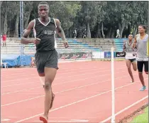  ??  ?? NOT SWEAT: Barefoot Andile Sikhumba, of the Amatola District, claims the first prize in the U17 boys 800m event