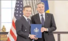  ?? -REUTERS ?? WASHINGTON
US Secretary of State Antony Blinken accepts Sweden's instrument­s of accession from Swedish PM Ulf Kristersso­n for its entry into NATO.