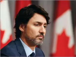  ?? CP PHOTO SEAN KILPATRICK ?? Prime Minister Justin Trudeau takes part in a press conference on Parliament Hill in Ottawa on Thursday. Trudeau says six people were aboard the Canadian Forces helicopter that crashed off Greece during a training exercise.