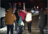  ?? WJLA VIA AP ?? Migrant families get on to a bus to transport them from near the Vice President's residence to an area church after they arrived in Washington on Saturday.