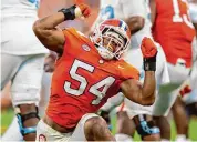  ?? Jacob Kupferman/Associated Press ?? Clemson linebacker Jeremiah Trotter Jr. reacts during a 2023 game against North Carolina in Clemson, S.C. Trotter Jr. wears his dad’s No. 54.
