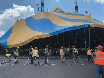 ?? PHOTO COURTESY OF CIRQUE DU SOLEIL ?? Crews set up the tent Friday, July 12 for the upcoming Montgomery County Cirque du Soleil engagement. The Big Top was raised on the grounds of the Greater Philadelph­ia Expo Center in Upper Providence. The show opens July 24. This photo shows some of the more than 60 crew members required to erect the tent.