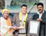  ??  ?? POST Editor Krisendra Bisetty, centre, accepts the Ammen award from Minister Nkosazana Dlamini Zuma, left, and Seelan Achary, chairperso­n of the Shri Mariammen Temple Society.
