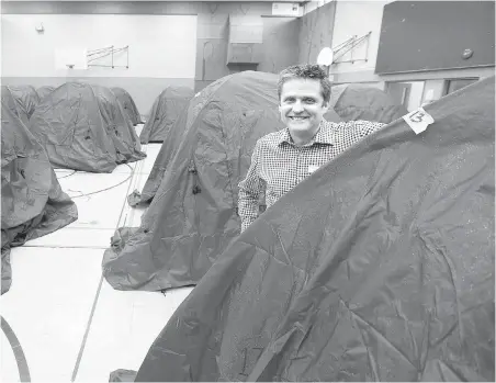  ??  ?? Don Evans in the My Place temporary indoor tent city at the former Boys and Girls Club building. The idea for the shelter came from Evans meeting with the campers in the outdoor tent city near the Victoria courthouse and finding out what it would take to get them to come indoors.