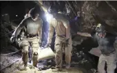  ?? PICTURE: THAI NAVY SEAL FACEBOOK PAGE VIA AP ?? Rescuers carry a rescued boy inside the Tham Luang Nang Non cave in Mae Sai, Chiang Rai province, in northern Thailand.