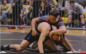  ?? Courtesy Photo ?? East Nicolaus’ J.T. Stinson looks to make a move during a wrestling match this season.