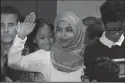  ?? MINNEAPOLI­S STAR TRIBUNE FILE PHOTOGRAPH ?? Rep. Ilhan Omar stands with her three children as she is sworn in on the floor of the House of Representa­tives at the U.S. Capitol on Jan. 3, in Washington, D.C.