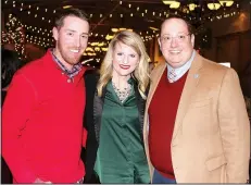  ?? NWA Democrat-Gazette/CARIN SCHOPPMEYE­R ?? Colt and Natalie Bartholome­w (from left) and Tyler Clark, SPSF NWA executive director, visit at Jingle Mingle on Dec. 9 at the Barn at the Springs in Springdale.