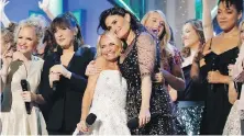 ?? NBC ?? Kristin Chenoweth, centre left, and Idina Menzel embrace during the NBC special A Very Wicked Halloween: Celebratin­g 15 Years On Broadway.