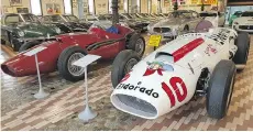  ??  ?? A Maserati 420M — nicknamed Eldorado — that was raced by Stirling Moss in the 1958 500 Miglia di Monza is just one of the cars and motorcycle­s displayed at the Panini Motor Museum in Baggiovara, Italy.