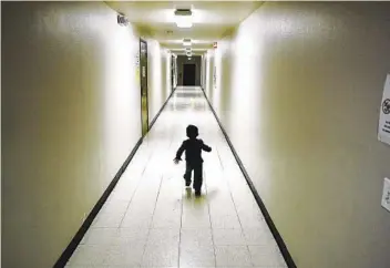  ?? GREGORY BULL AP FILE ?? A boy from Central America whose family is seeking asylum in the U.S., runs down a hallway after arriving from an immigratio­n detention center to a shelter in San Diego in December 2018.