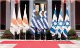  ??  ?? The flags of Cyprus, Greece and Israel are seen at Zappeion Hall in Athens, during the ceremony for the signing of the EastMed gas pipeline deal between the three countries last January.
