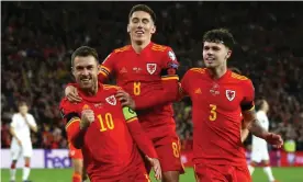  ?? Photograph: Gareth Everett/Huw Evans/Shuttersto­ck ?? Aaron Ramsey (left) hopes Wales can secure another landmark win over Belgium.