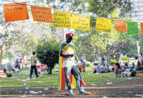  ?? AP ?? Handwritte­n notes show the hopes of protesters in Harare as Mr Mugabe resigns on Tuesday after 37 years in power.