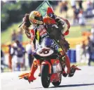  ??  ?? Rossi’s celebratio­ns became an event in themselves. Here is the famous chicken from 1998