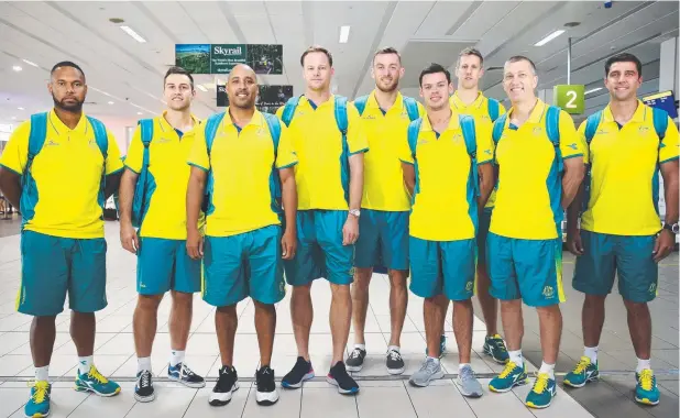  ?? Picture: BRENDAN RADKE ?? RARING TO GO: Members of the Australian men's basketball team arrive at Cairns Airport to prepare for their three pool games in the Far North.