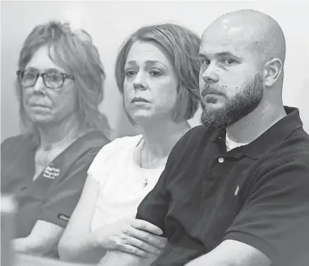  ?? LIZ DUFOUR/CINCINNATI ENQUIRER ?? Tommy Hancock, right, and his wife, Sarah, listen in 2016 as his son is sentenced.