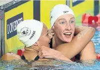  ?? MARK SCHIEFELBE­IN/THE ASSOCIATED PRESS ?? Kylie Masse earned gold in the 100-metre backstroke, while compatriot Taylor Ruck followed with a third-place finish.