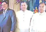  ??  ?? Oriental Mindoro Rep. Rey Umali, Manila Economic and Cultural Office director Manny Dimaculang­an and Eric Gutierrez.