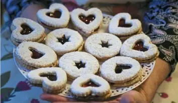  ?? Jessie Wardarski/Post-Gazette photos ?? Jam-filled Linzer cookies are among the dozens being sent to Uvalde, Texas, by the Wedding Cookie Table Facebook Group.