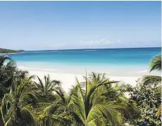  ??  ?? Flamenco Beach is a long crescent of white sand edged by turquoise water on Culebra, a sparsely populated cay off Puerto Rico’s east coast.